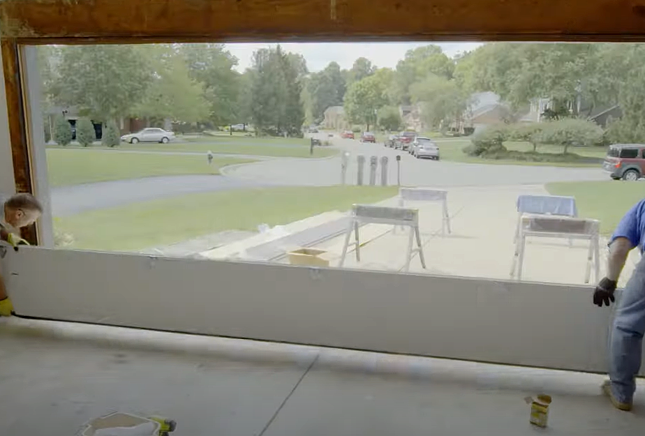 Technician performing garage door panel repair, showcasing the before and after of a damaged panel being professionally fixed.