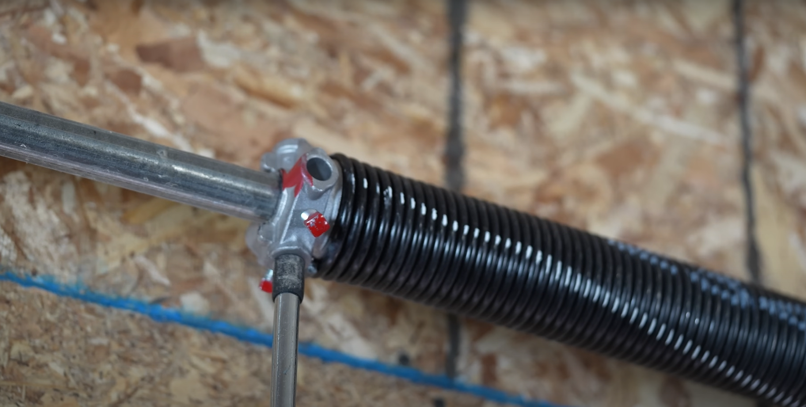 Expert in Reynoldsburg Ohio doing garage door spring repair.