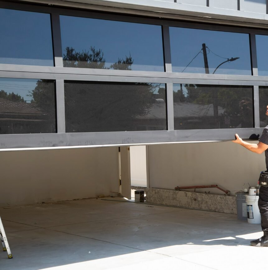 Technician performing garage door repair in Reynoldsburg, showcasing professional service and quality craftsmanship.