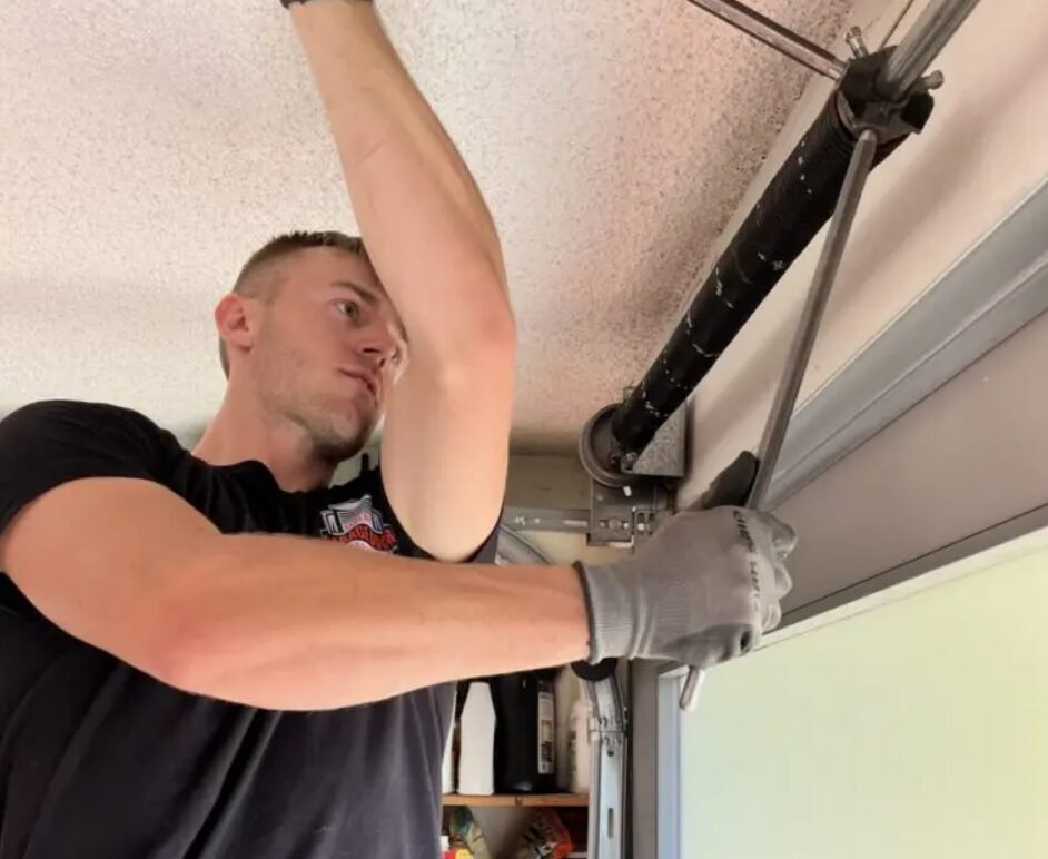 Close-up of a technician performing garage door spring repair in Reynoldsburg, showcasing professional service and quality craftsmanship.