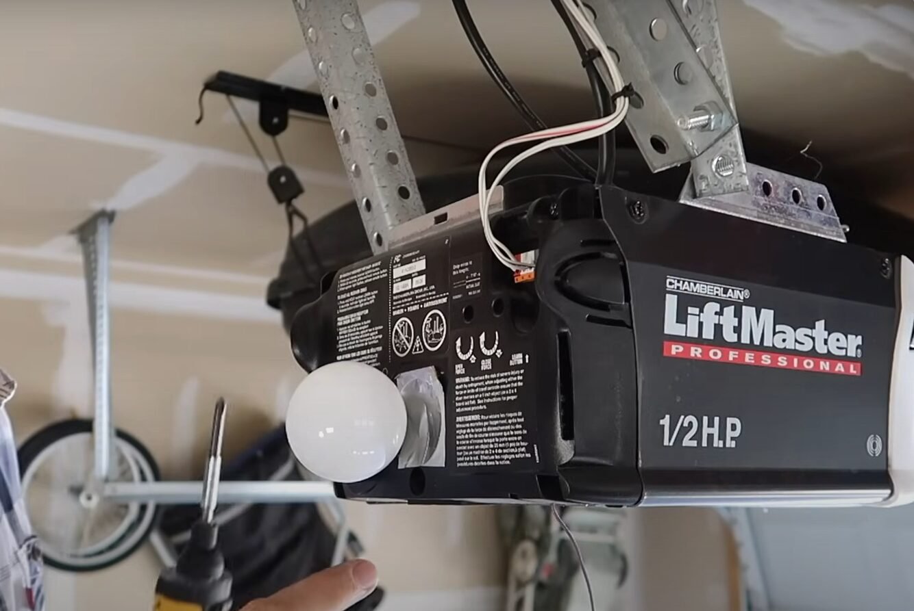 Technician performing garage door opener repair in Reynoldsburg, showcasing high-quality service and expertise.