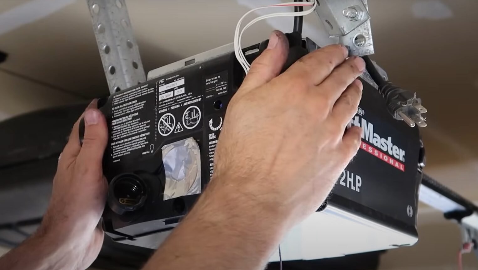 a technician performing garage door opener repair in Reynoldsburg, showcasing expert service and high-quality tools.